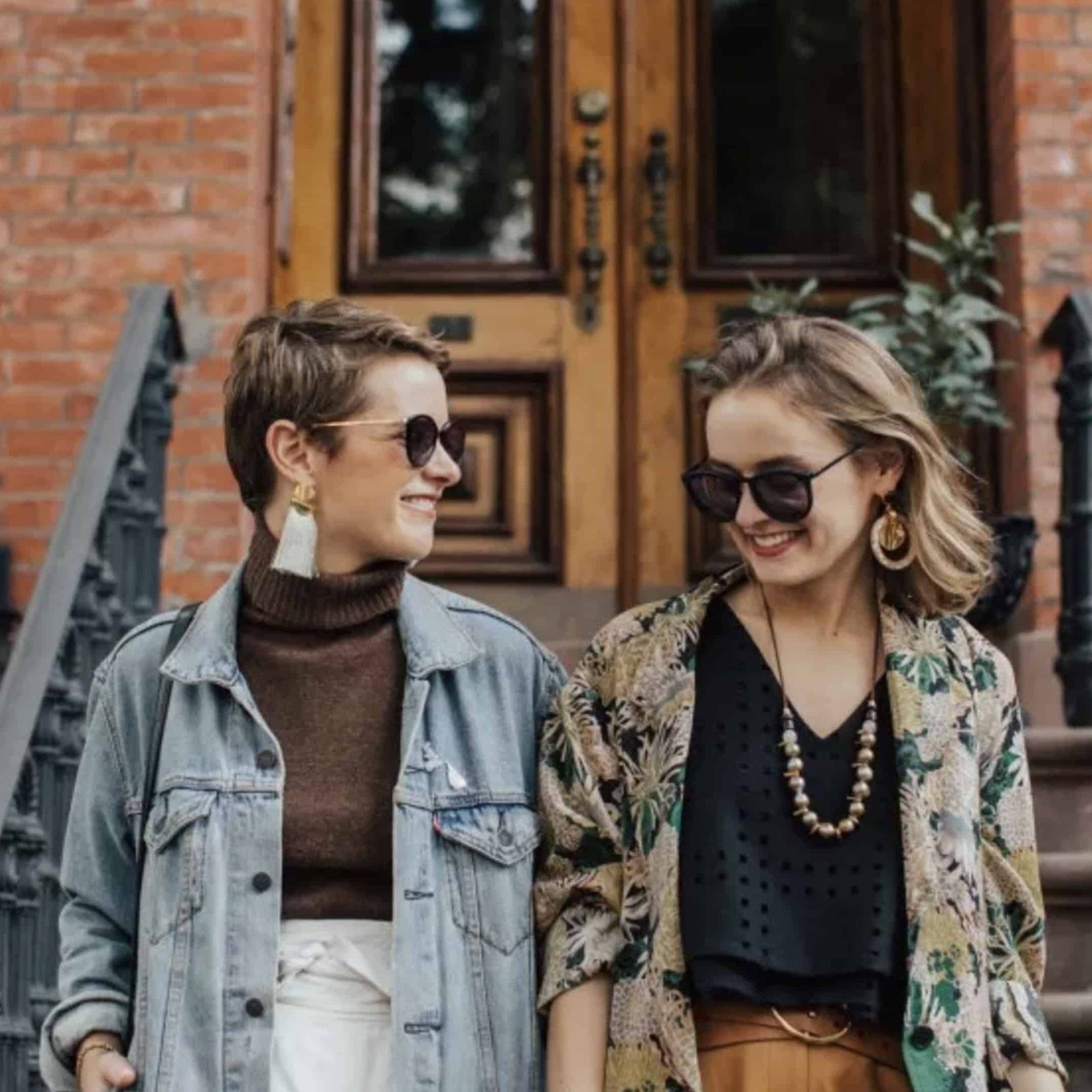 Lizzie and Kathryn Fortunato twins on front steps of brownstone wearing various statement jewels