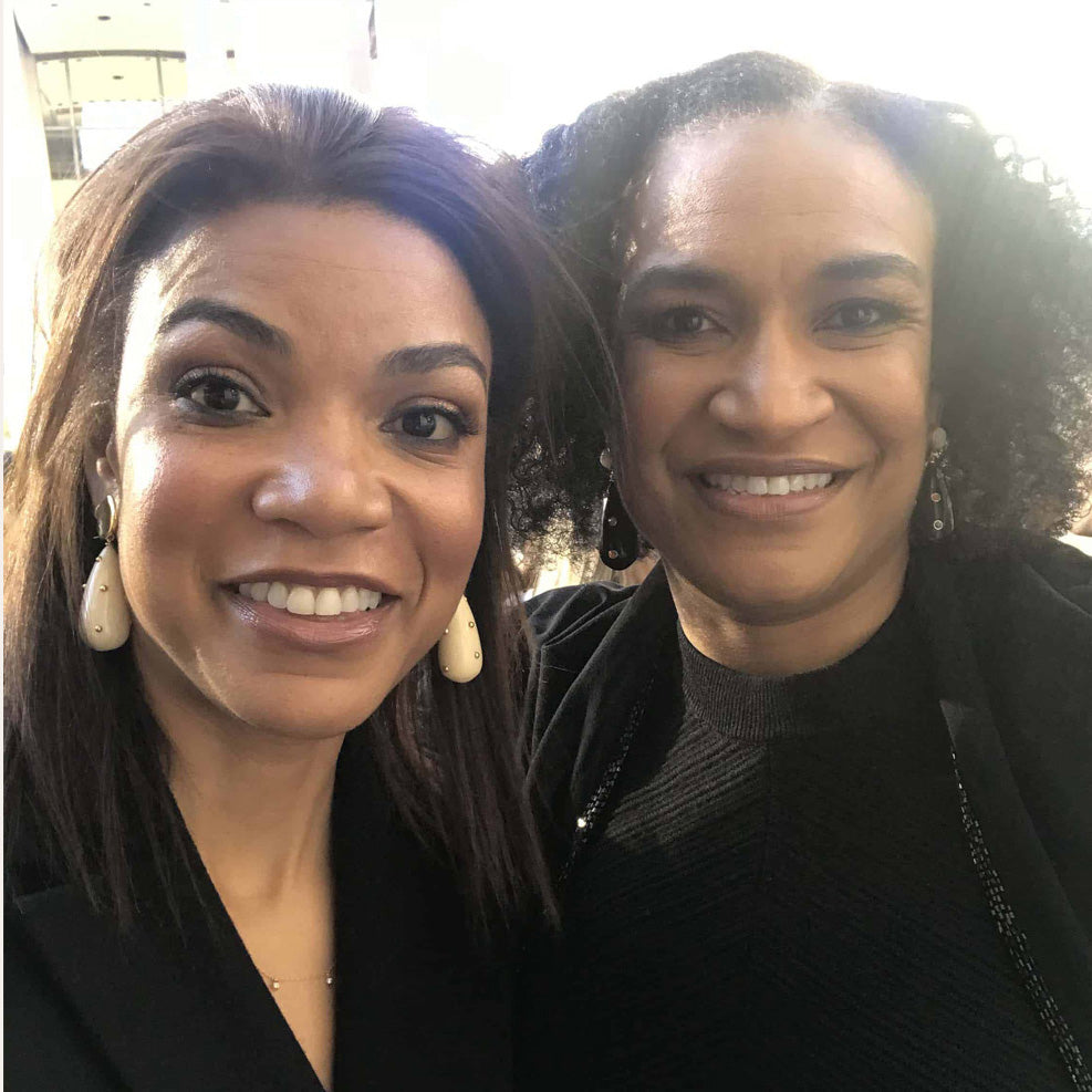 Two women in black wearing Lizzie Fortunato drop earrings