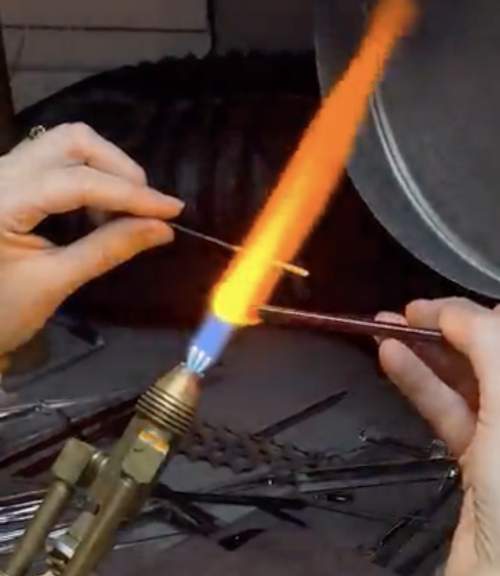 Our glass pieces are produced by an artisan in upstate New York, who heats rods of glass in a 2,000 degree flame and molds them by hand into our designs.