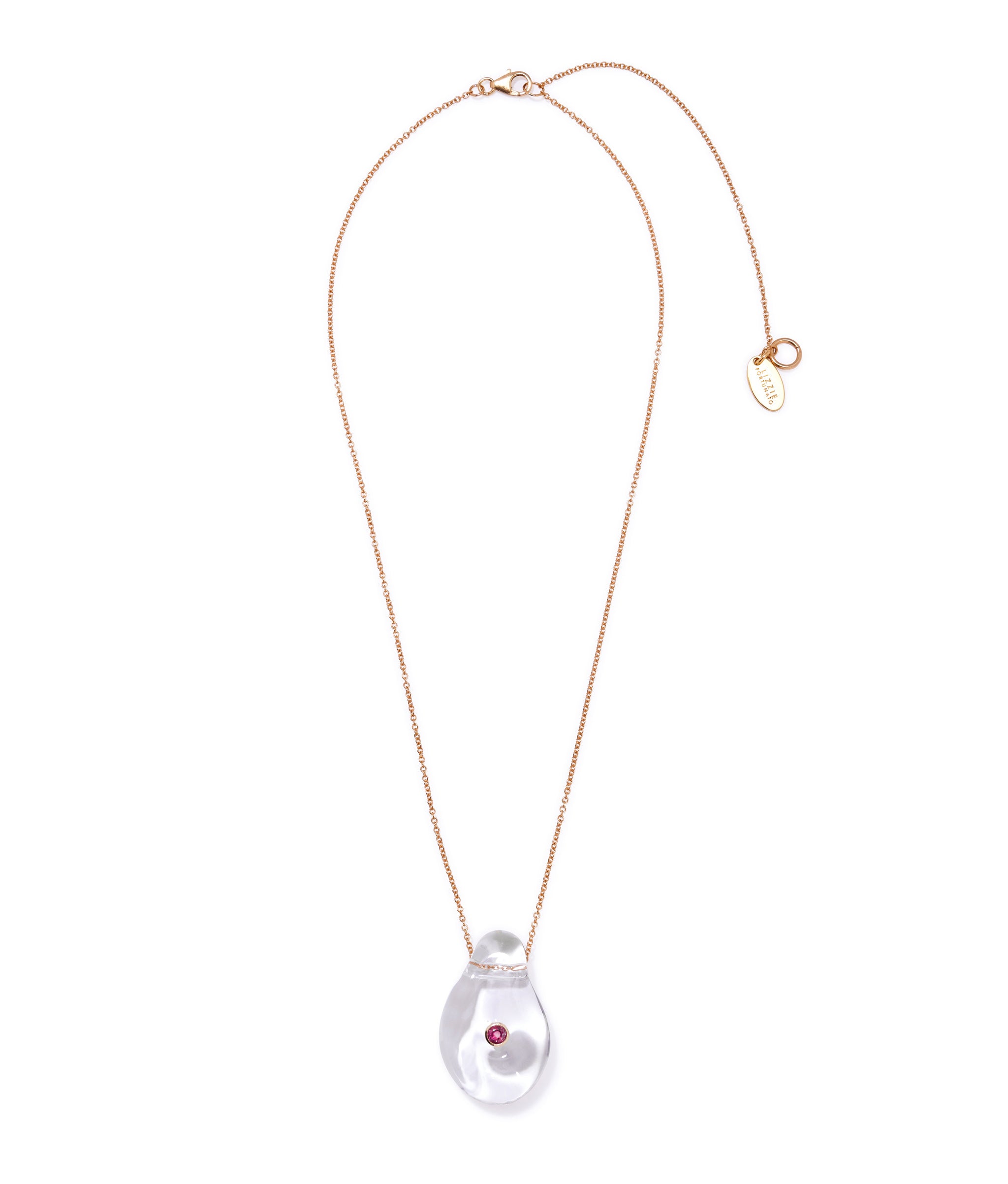 Muse Pendant Necklace in Clear. Thin gold-plated silver chain with clear glass teardrop pendant inset with rhodolite