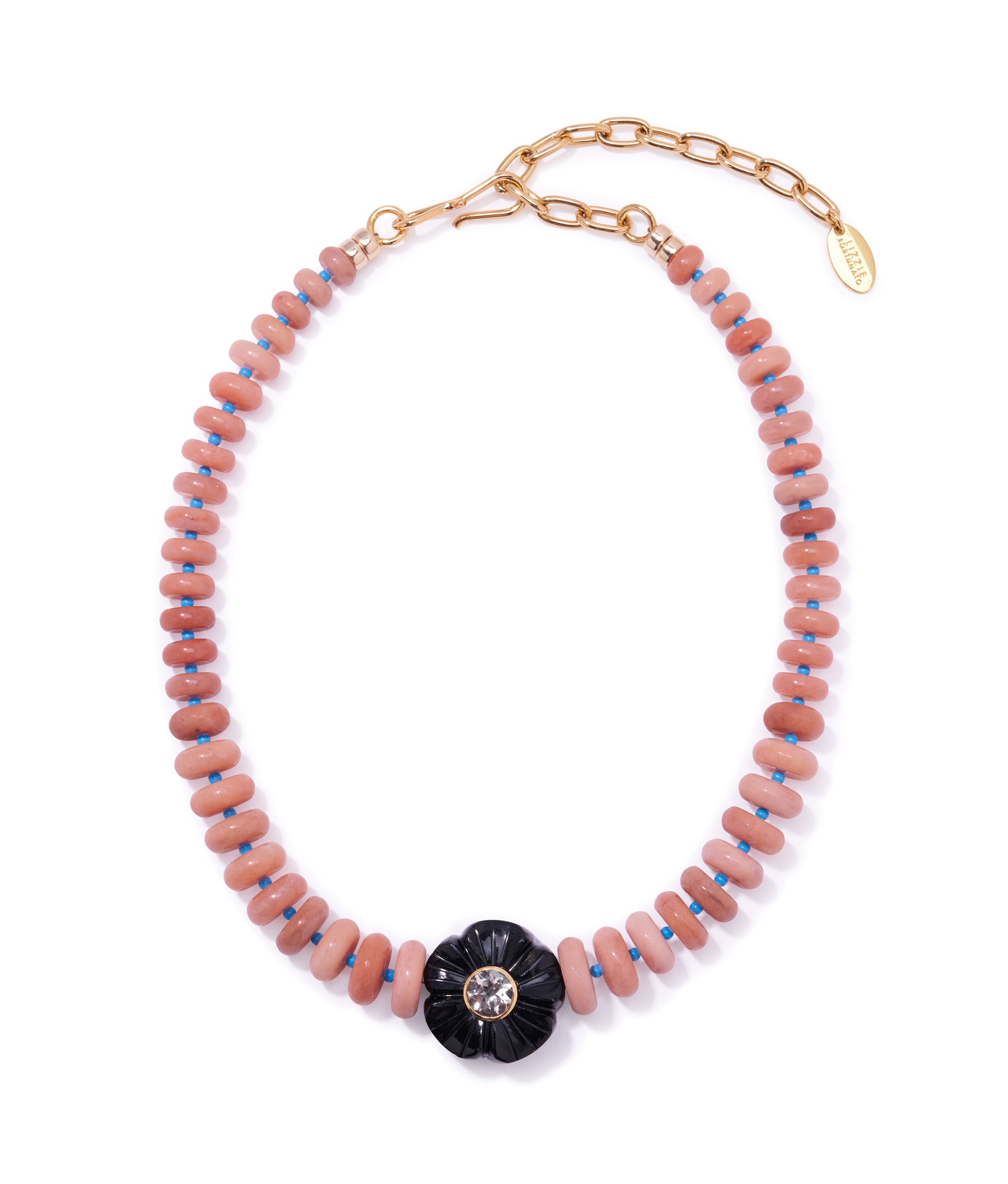 Peach Blossom Necklace. With graduated peach quartz beads interspersed with blue howlite and etched black flower focal.