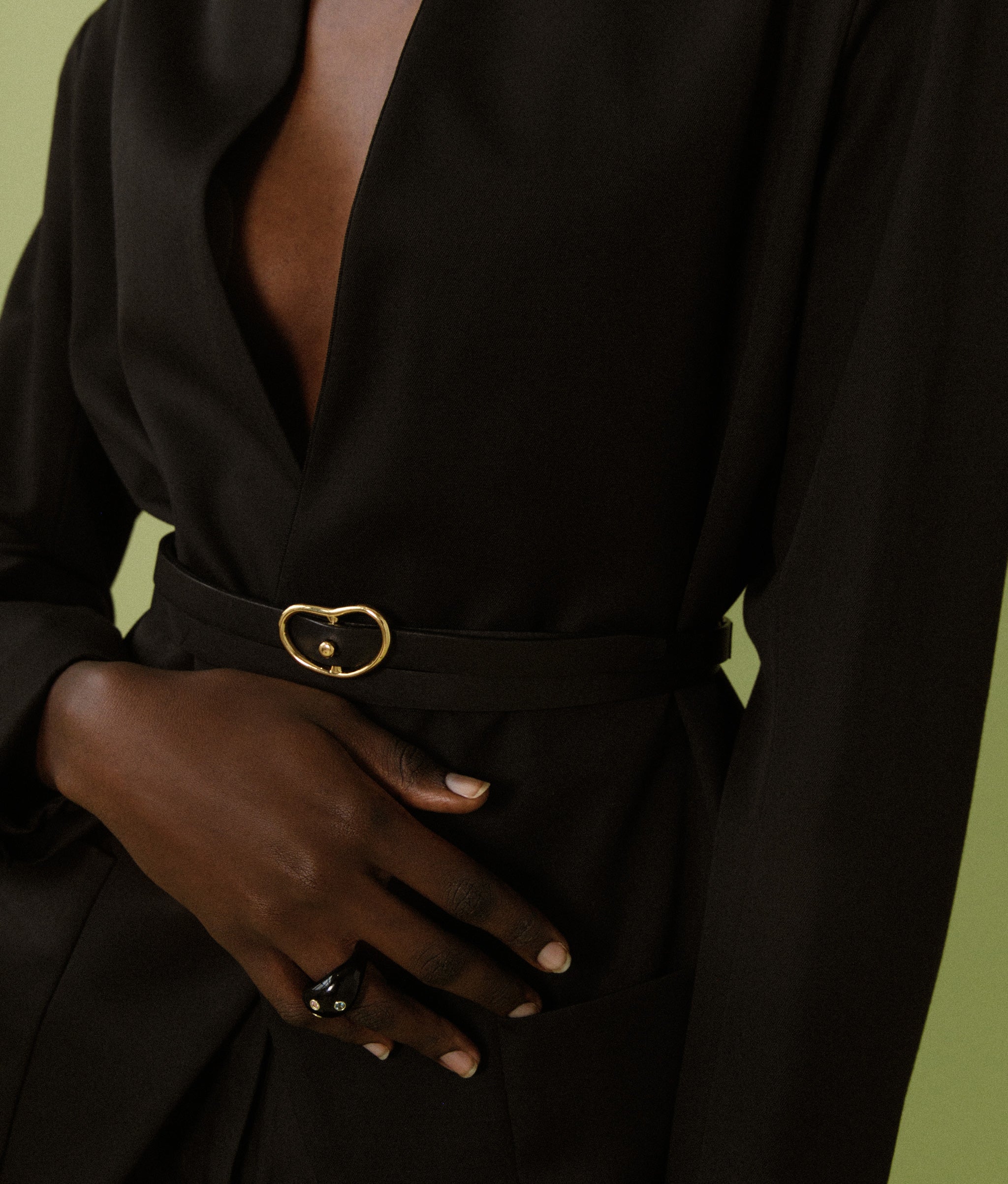 Model's torso in close-up, in black blazer and Double Wrap Georgia Belt in Black.