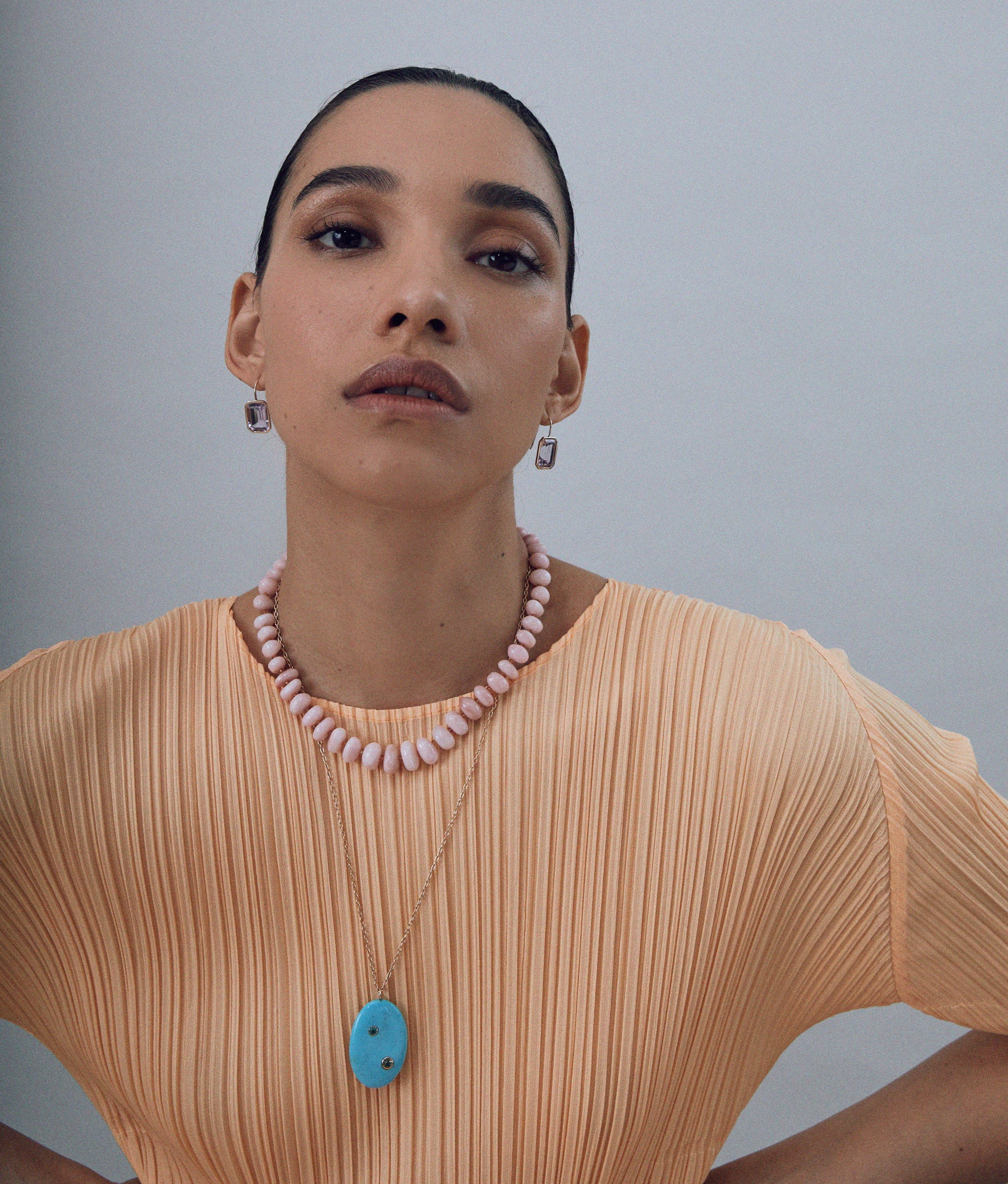 Model wears Pink Opal & Yellow Sapphire 14k Gold Necklace styled with other lizzie Fortunato's pieces.