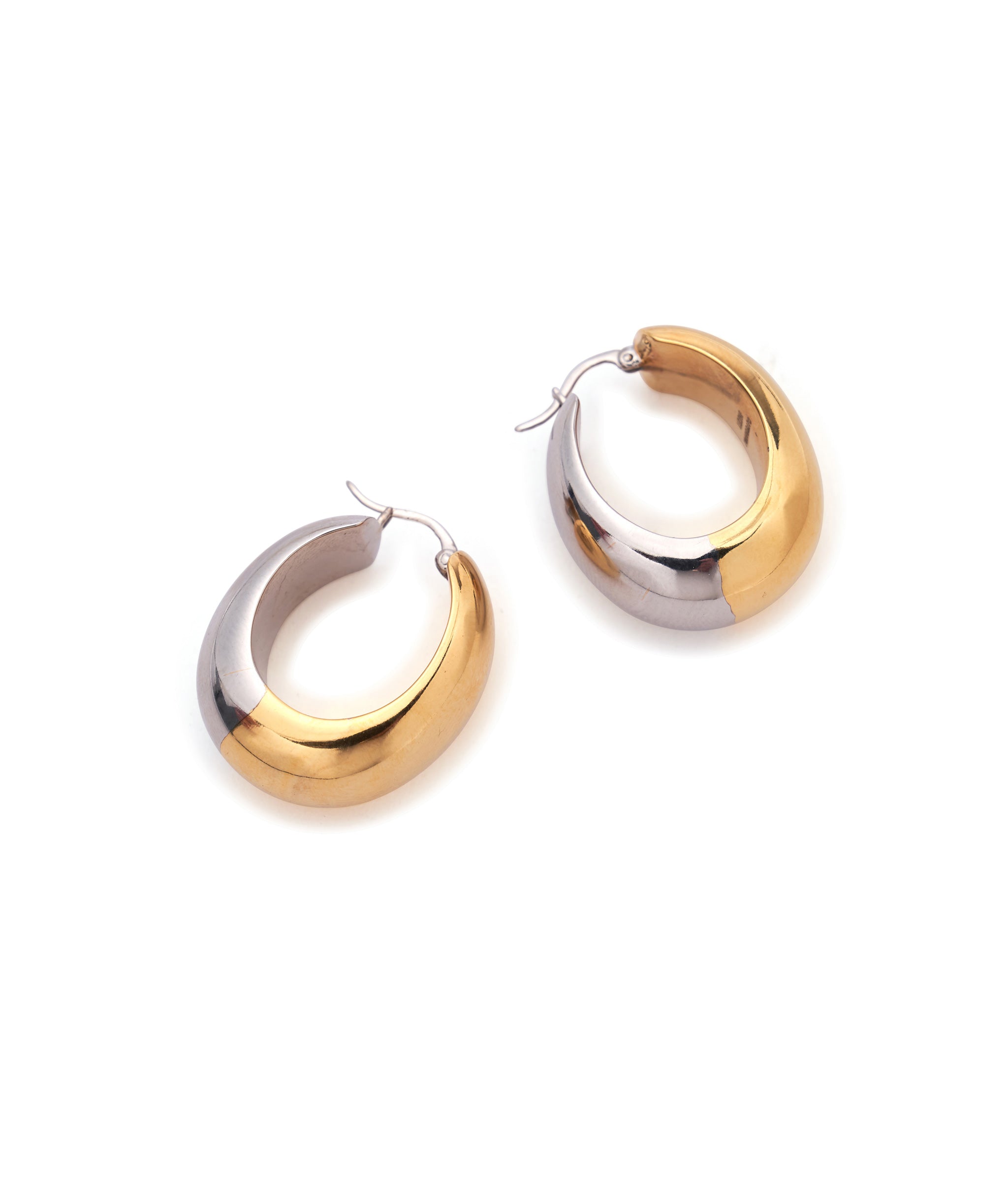 Bubble Hoops in Mixed Metal. Small, hollow puffy hoop earrings in half gold and half silver. Side view.