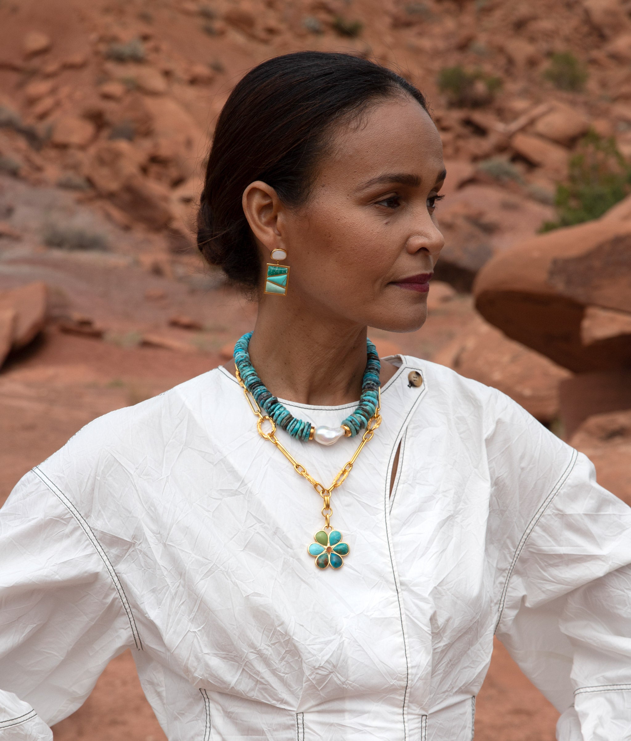  Model in desert wears white dress with Sky Stone Necklace, Desert Daisy Necklace and Sky City Earrings.