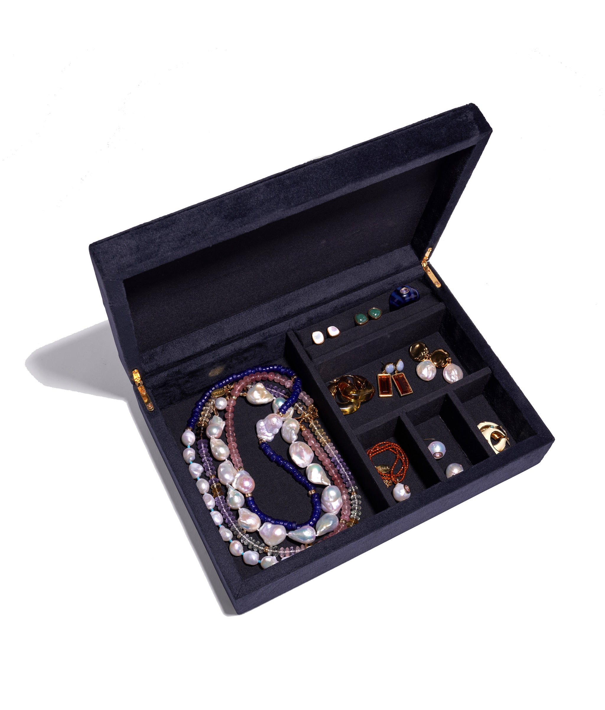 Modern Love Jewelry Box with top open to display assorted colorful jewelry stored in its compartments.