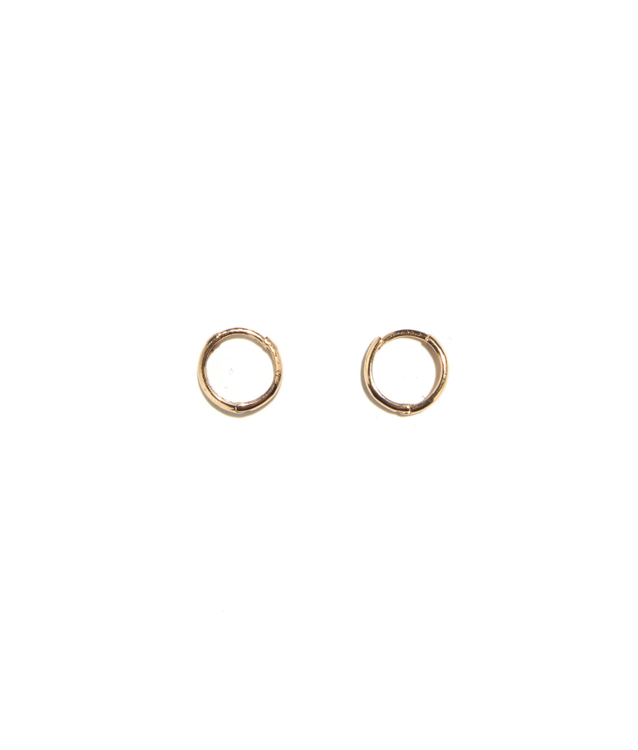14k Huggies. Pair of mini fine gold hoop earrings.