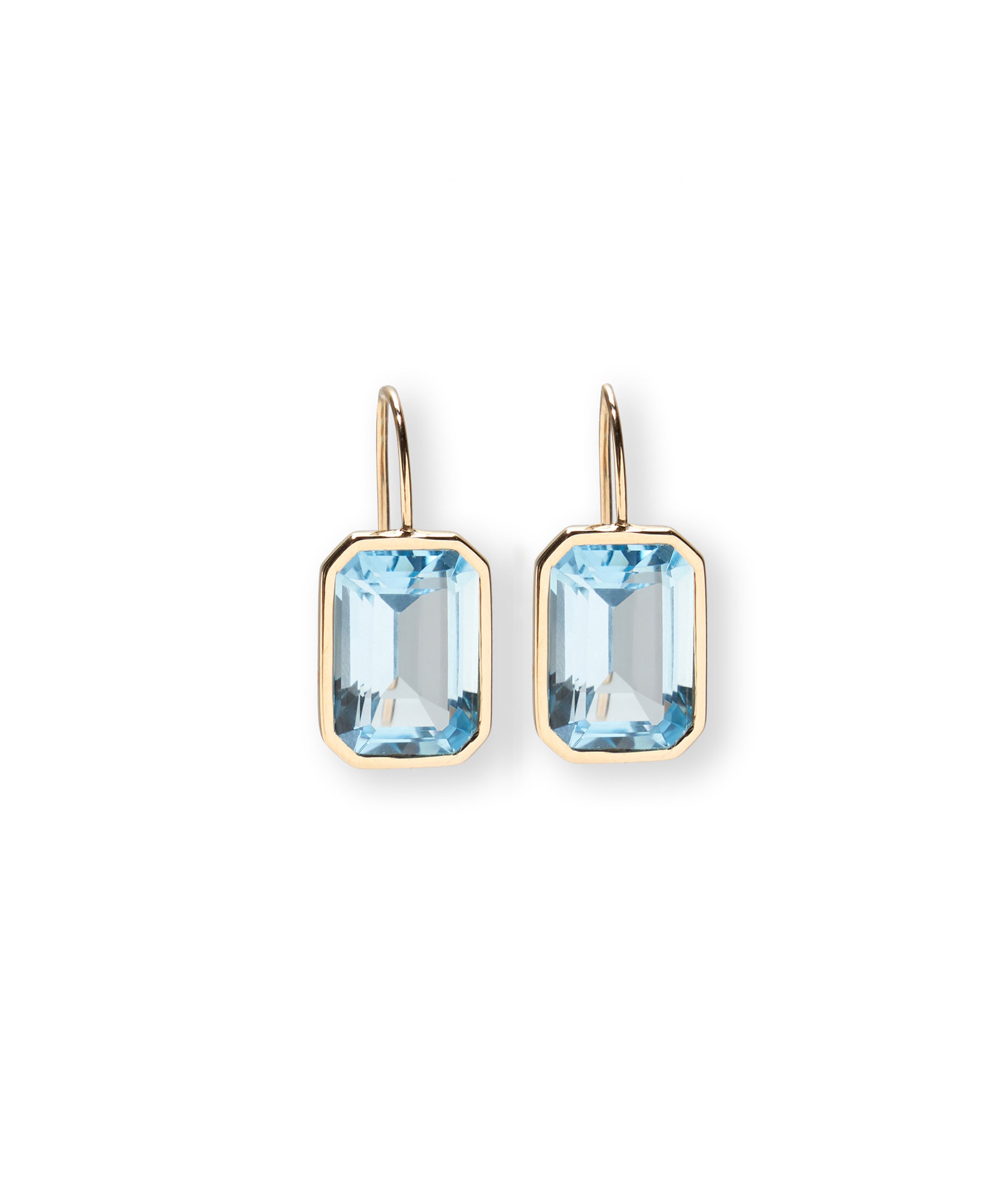 Aria Earrings in Sky Blue Topaz. Featuring large, faceted sky blue topaz stones with 14k gold bezels and earwires.