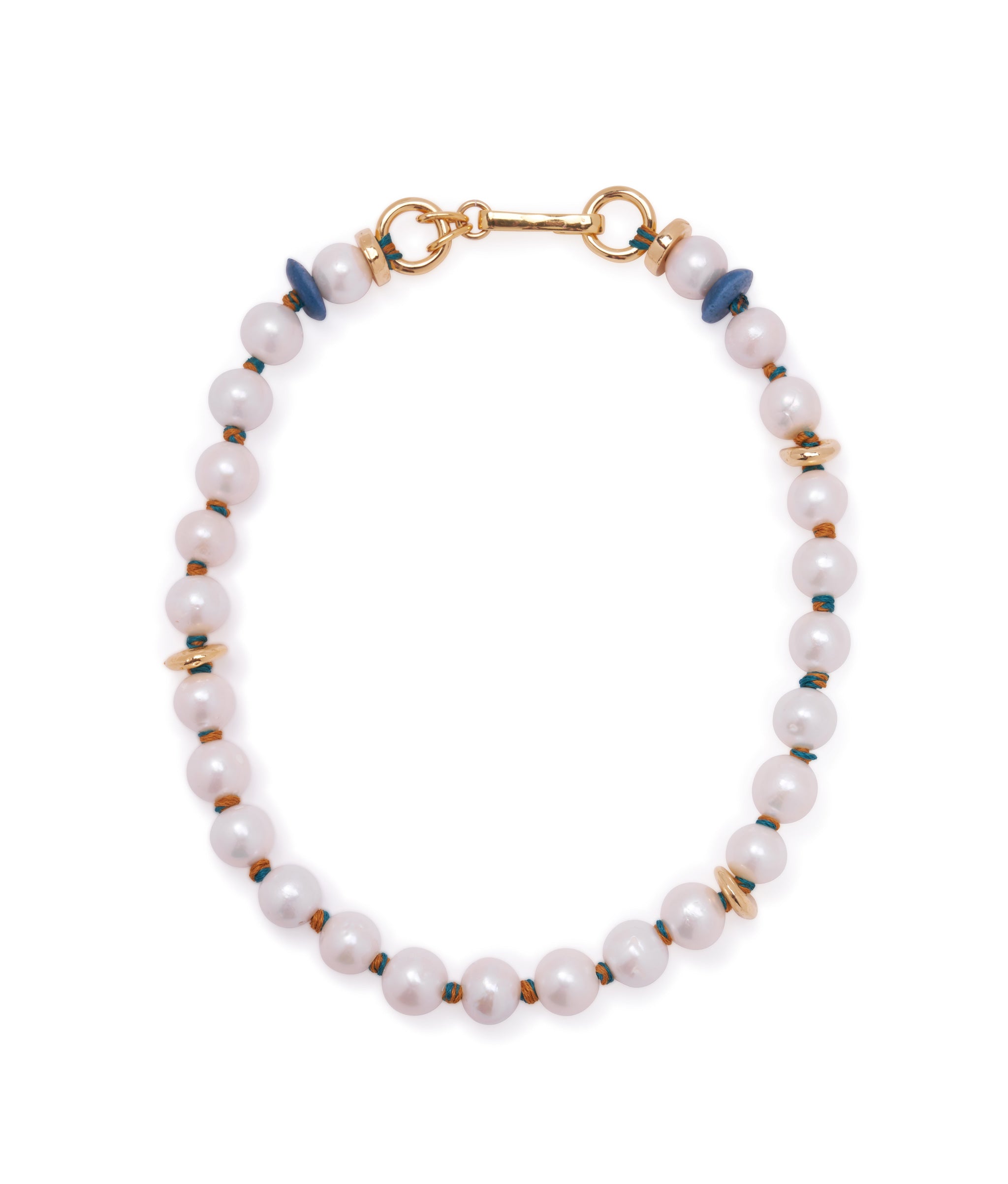 Pacifica Pearl Collar. Freshwater pearl necklace knotted with orange and blue thread, with gold-plated hook closure.Pacifica Pearl Collar. Pearl necklace with color-blocked cotton thread knotting and a gold-plated brass hook closure.