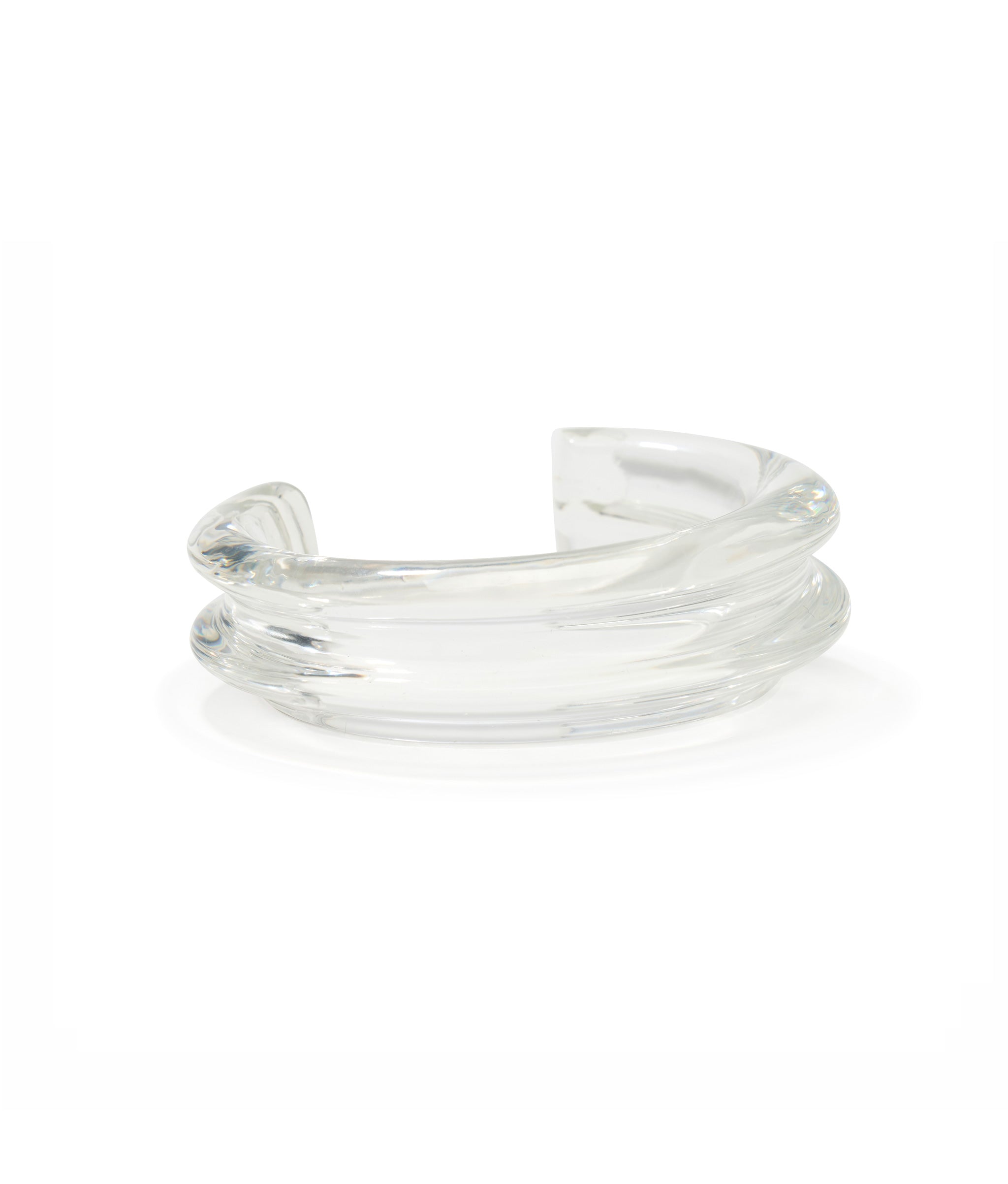 Onda Cuff in Clear made with transparent resin sculptural cuff inspired by the curl of an ocean wave.