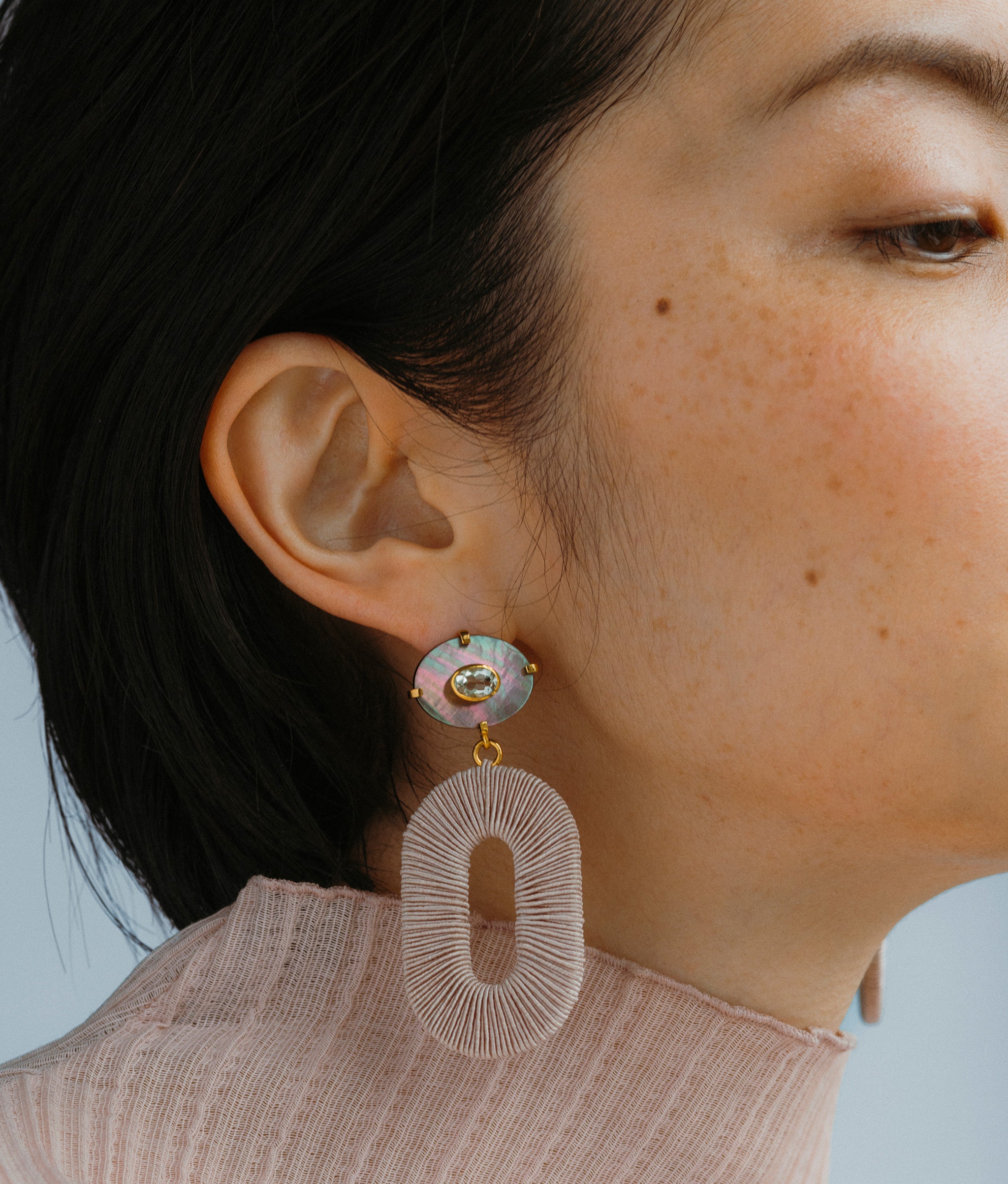 (Close-up) Model wears Adriatic Earrings In Black Pearl.