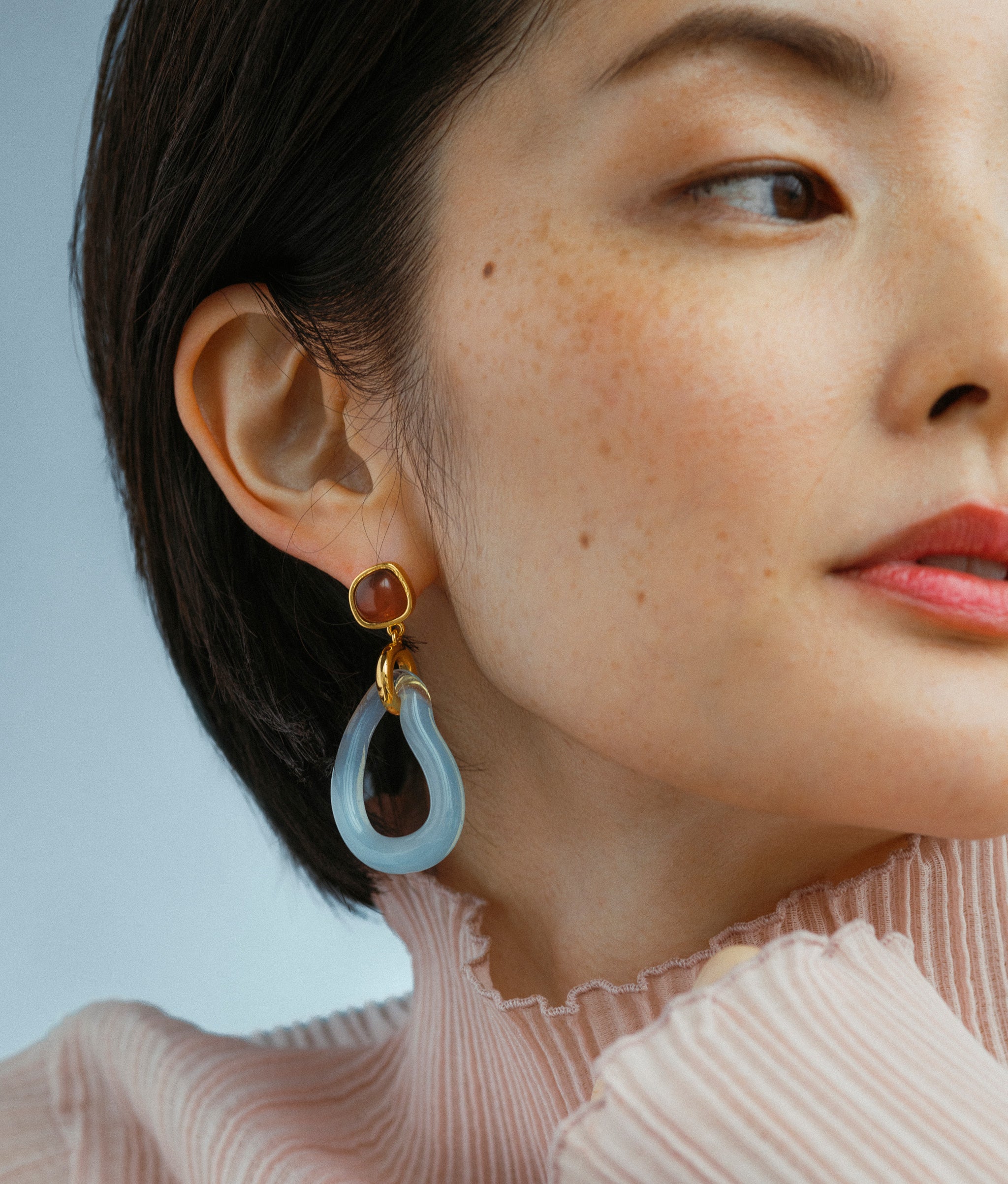 Close-up of Galina Earrings on model.