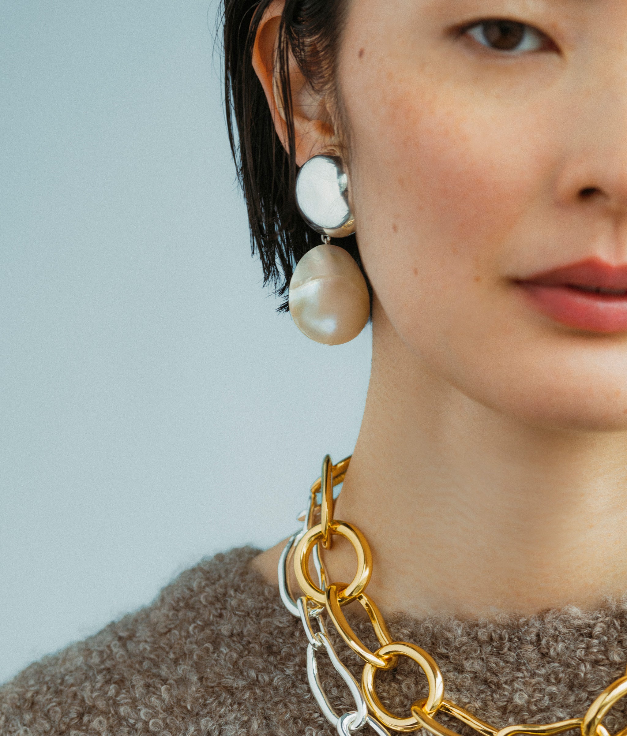 Close-up of model wearing  Rodan Pearl Earrings In Silver