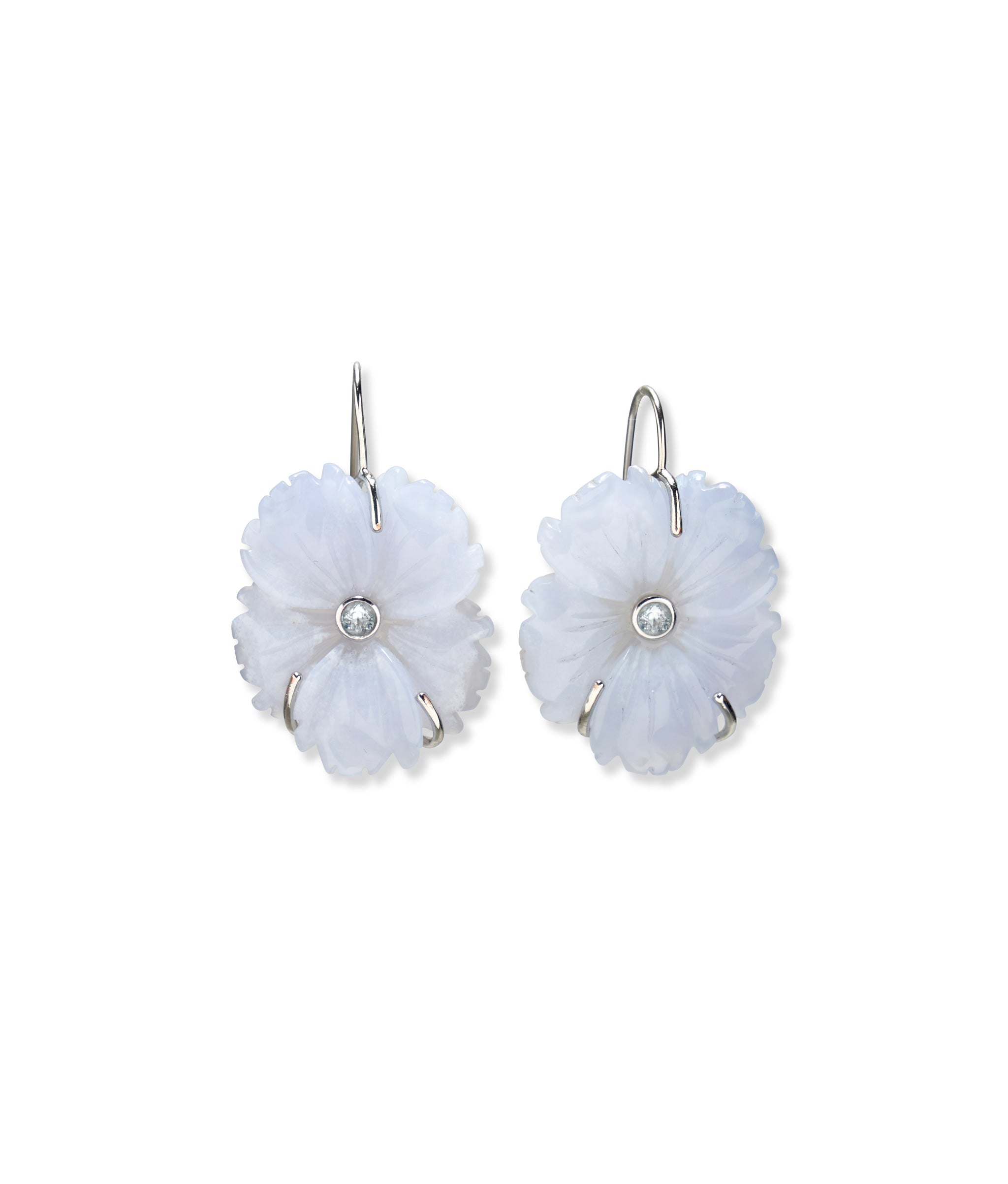 Carved chalcedony flowers set with faceted sky blue topaz stones in silver.