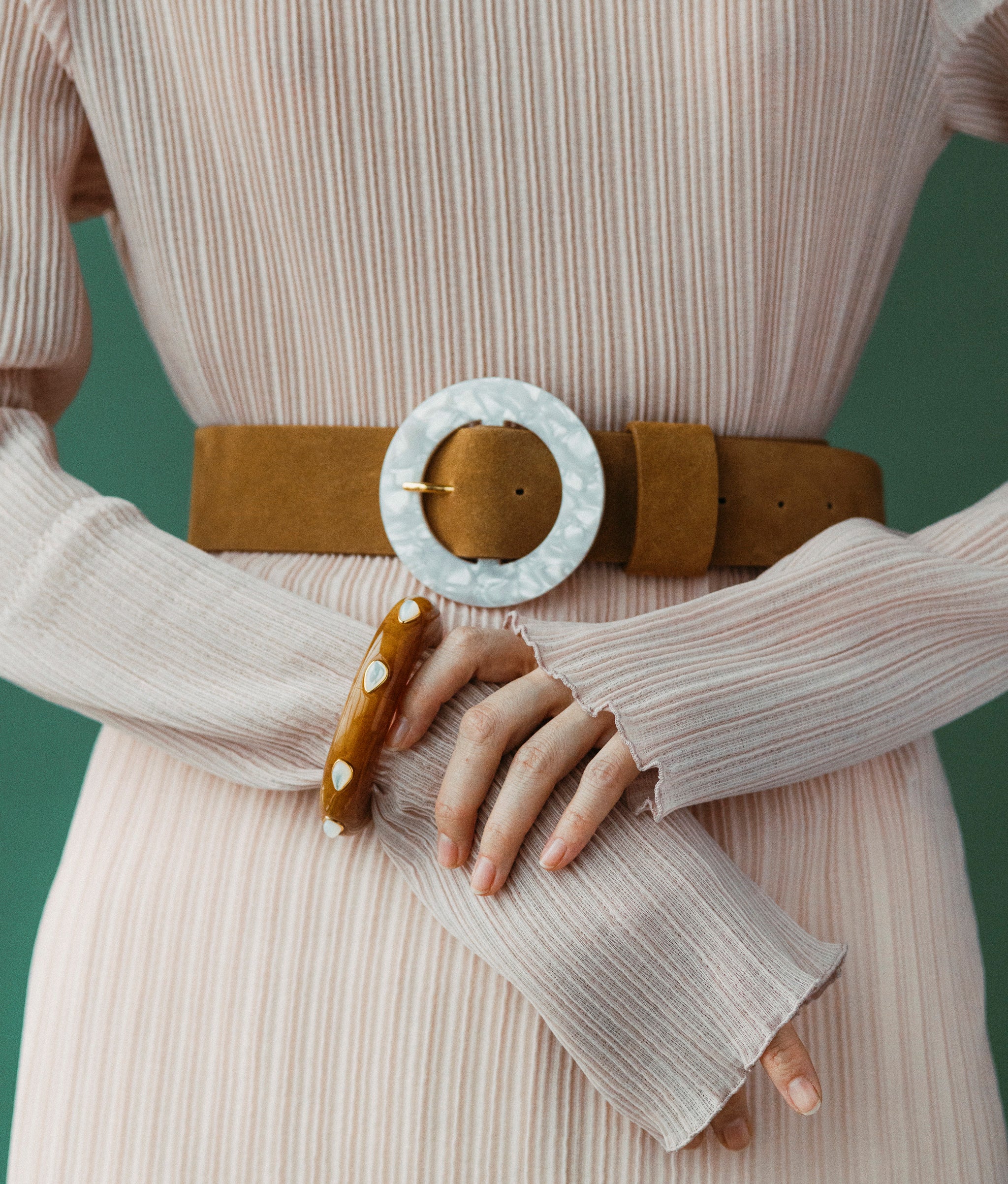 Louise Belt in Camel Suede styled on model with cuff bracelet 