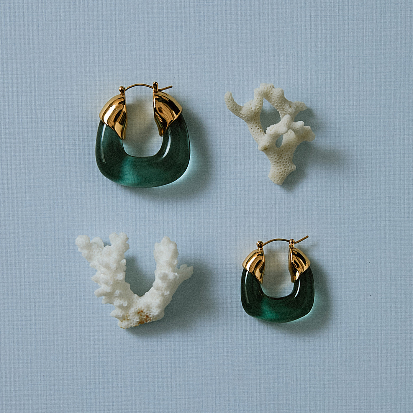 Blue background flatly with white coral and Organic Hoop and Mini in Forest