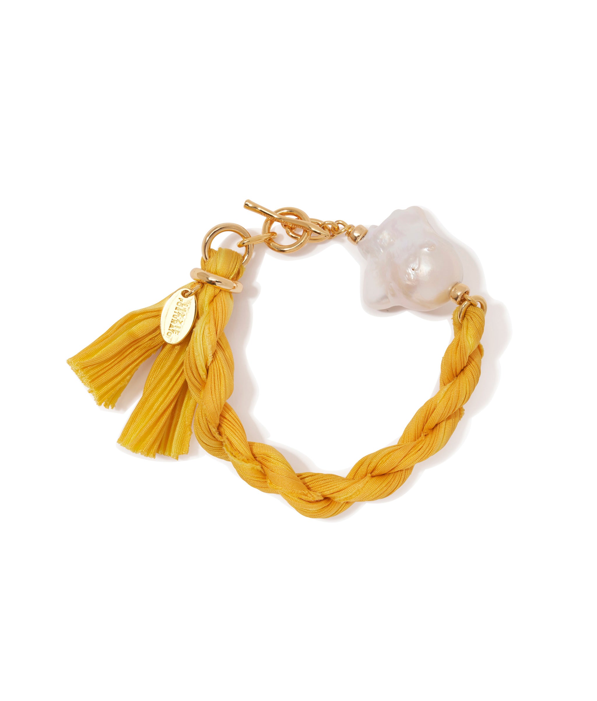 Shibori Ribbon Bracelet in Sun. Yellow shibori silk ribbon, large freshwater pearl and gold-plated toggle closure.