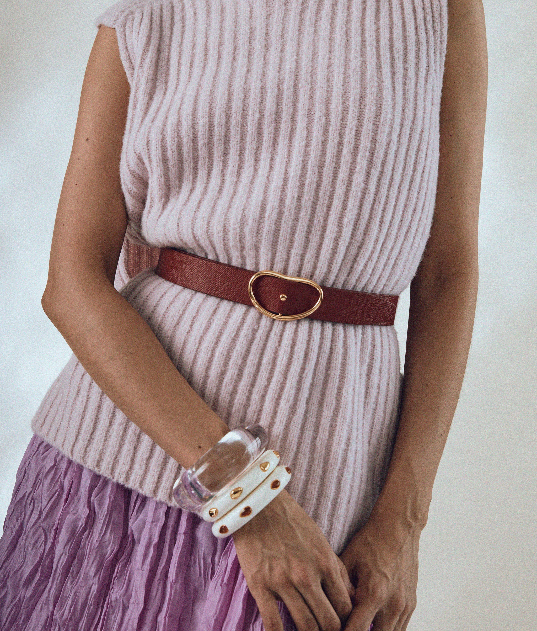 Model wears Ridge cuff In Alabaster Amber.