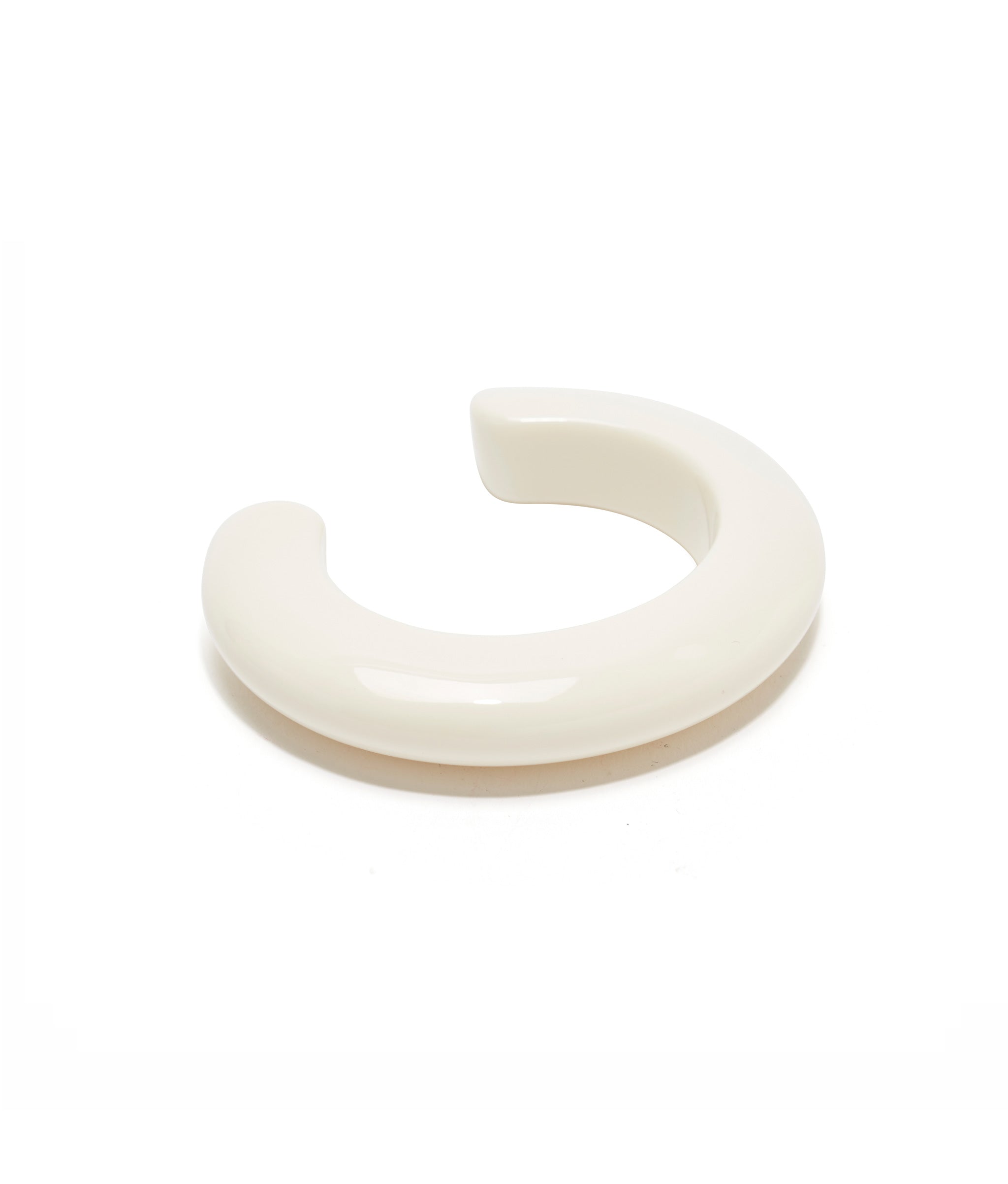 Ridge Cuff in Alabaster is an avory-colored, thin acrylic domed cuff.