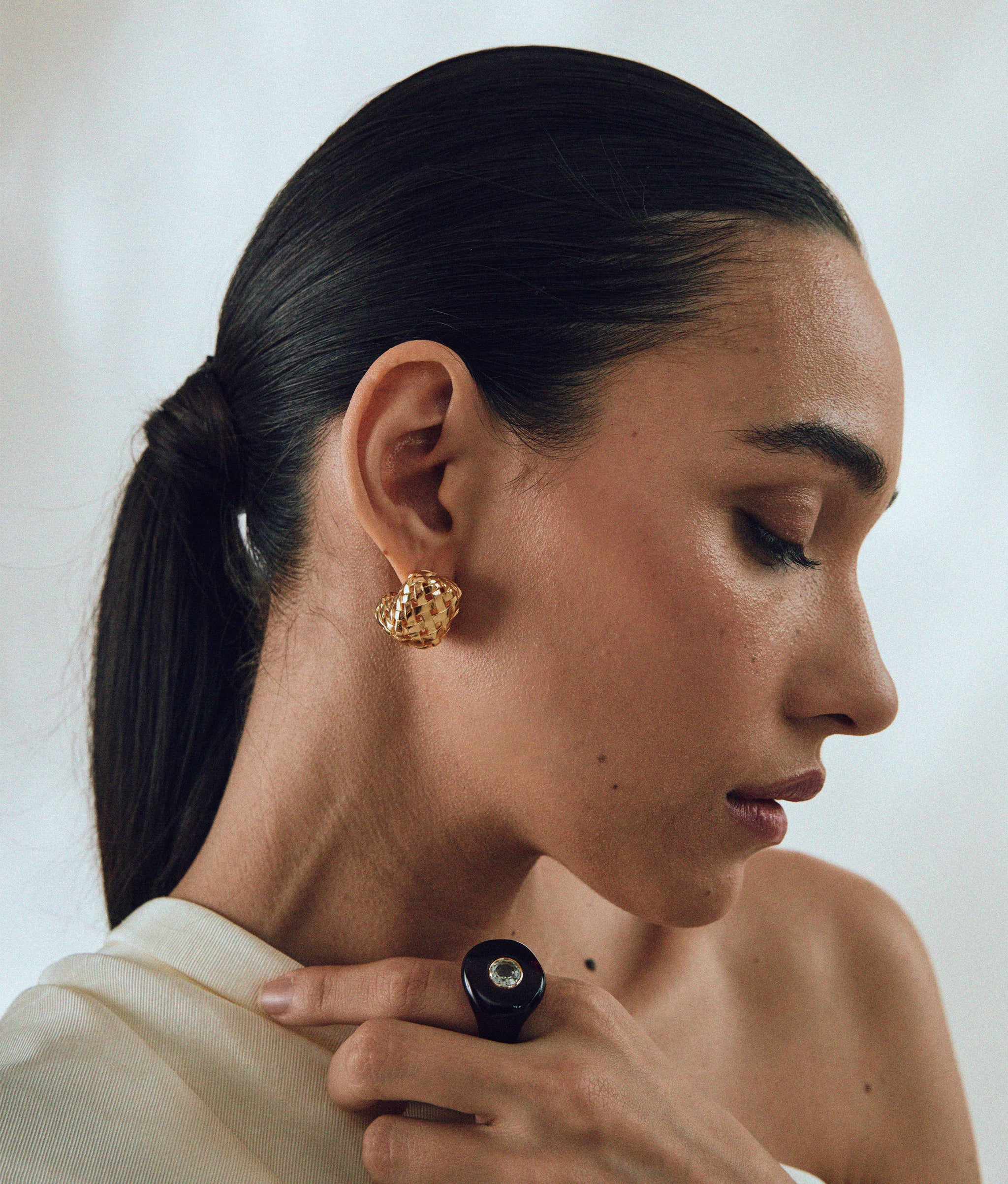 Model wears Woven Hoops In Gold 