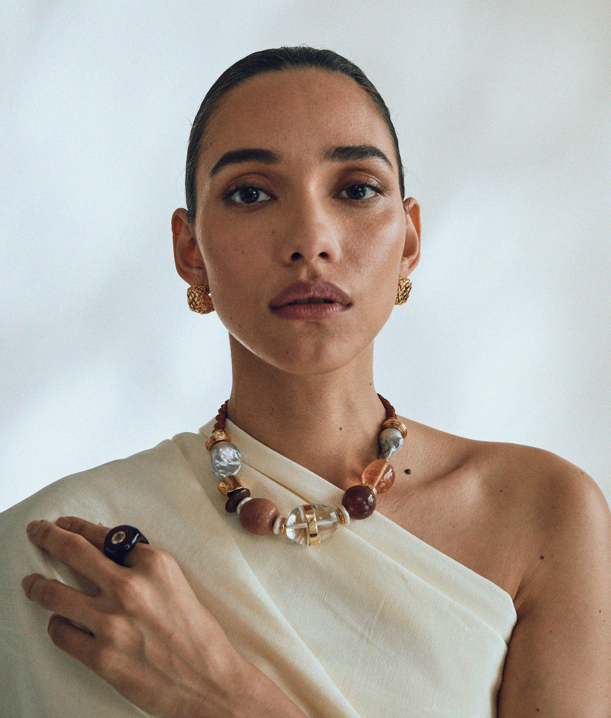 Model wears Woven Hoops In Gold styled with California Modern Collar.