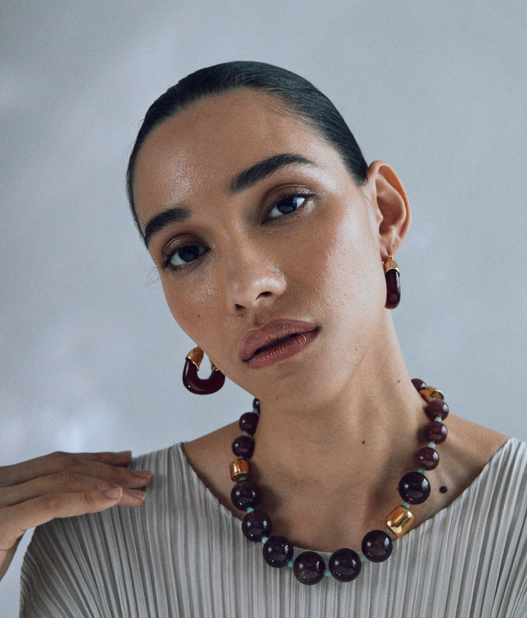 Model wears Organic Hoops In Currant.