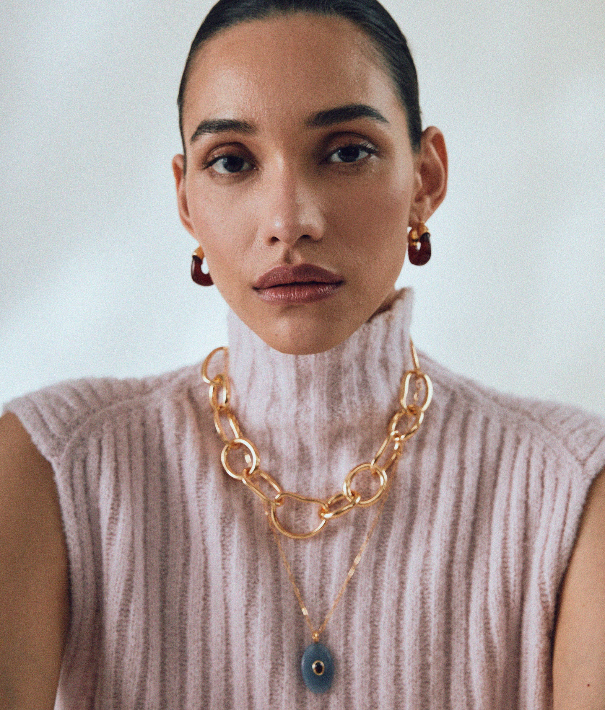 Model wears Mini Organic Hoops in Currant styled with Porto Chain and Atelier pendant Necklace.