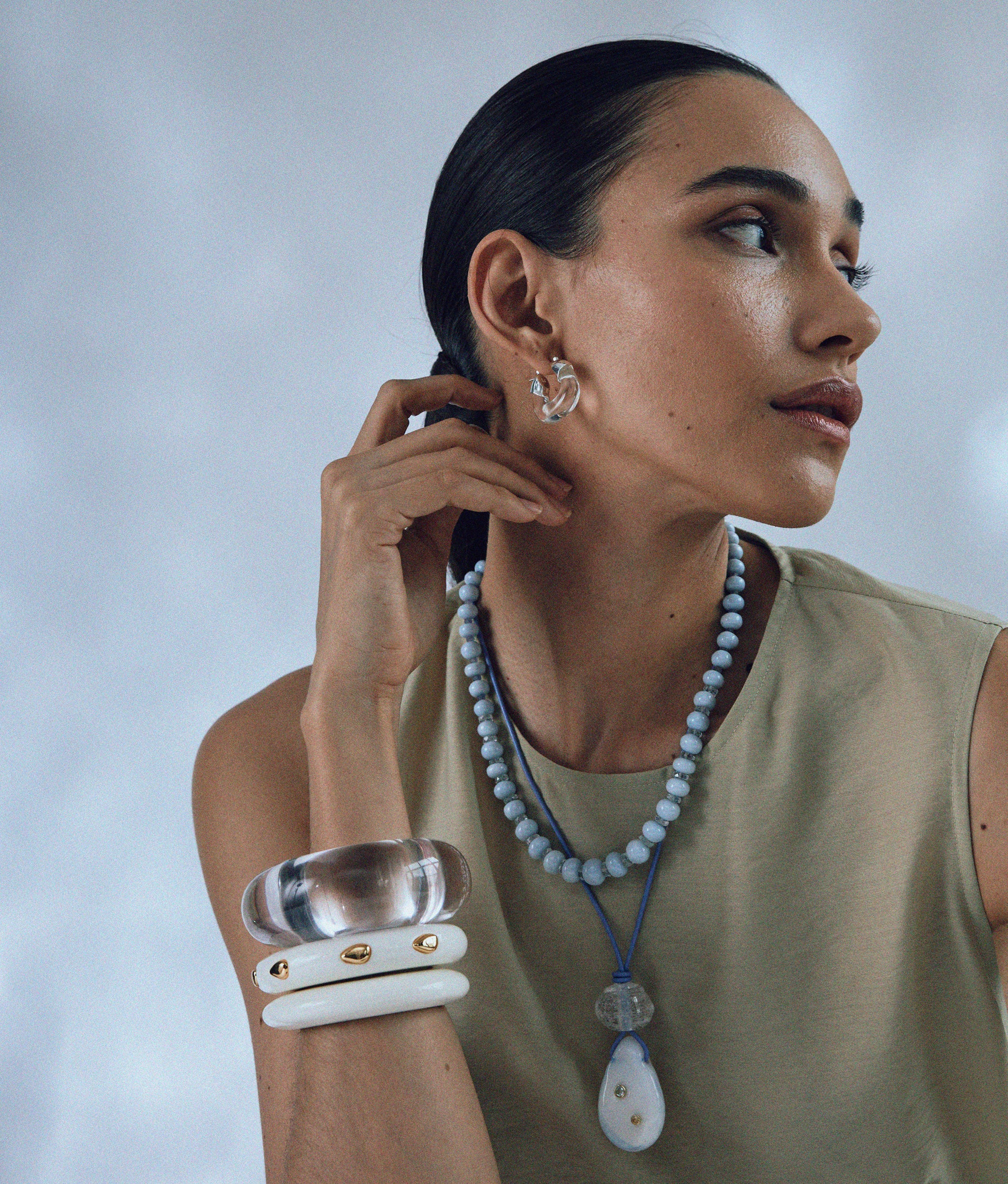 Model wears Matilde Cord Necklace styled with Seaside Cliffs Necklace and Lizzie Fortunato's cuffs.