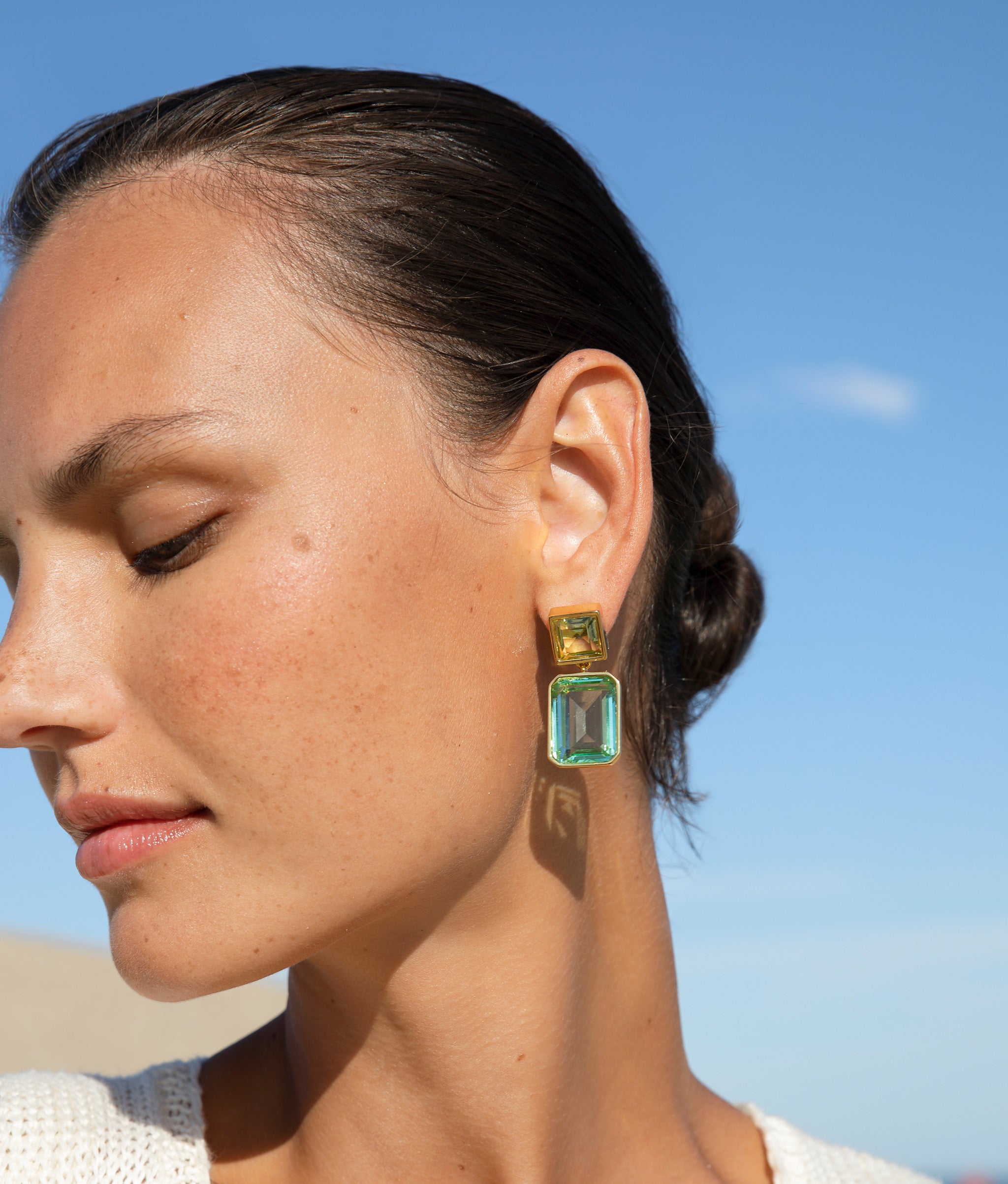 Close-up of model wearing the Lush Earrings in Atlantis.