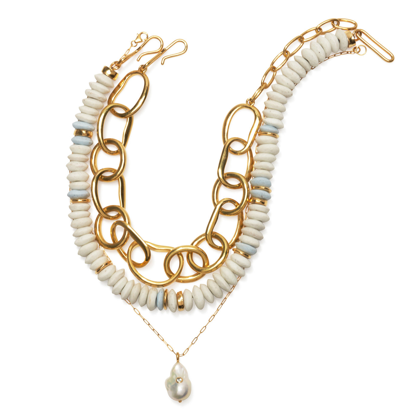 Flatlay with Porto Chain, Laguna Necklace in White and Oasis Charm Necklace