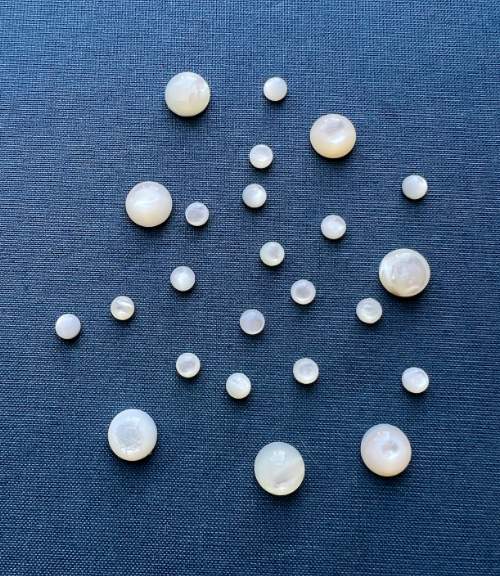 Unlike freshwater pearls, which can be drilled into beads, mother-of-pearl (technically "nacre") refers to the iridescent, inner shell layer of mollusks, which we use for pearl cabochons and pendants.