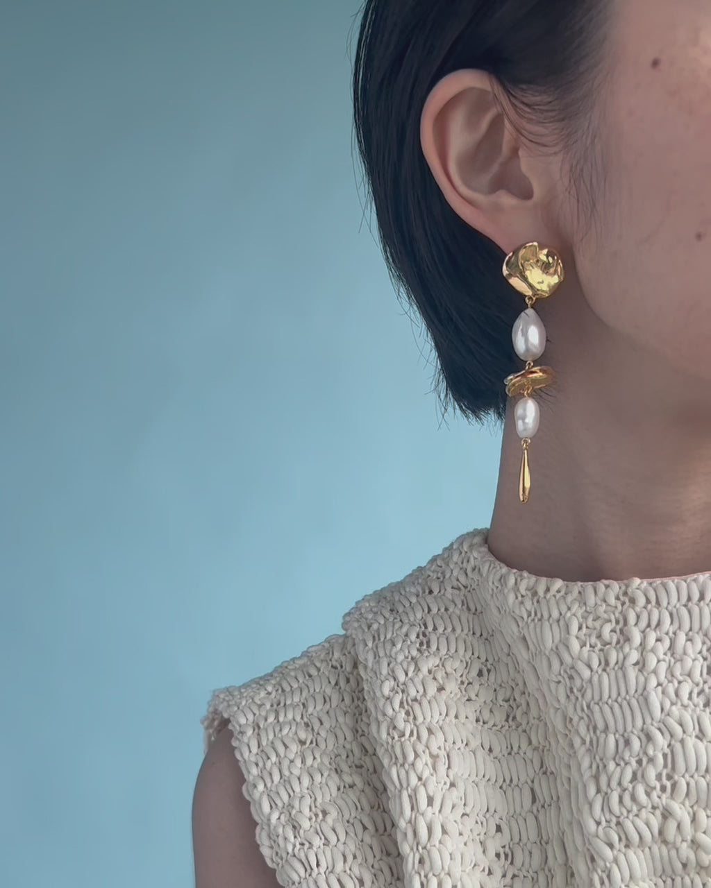 Video shows a close-up of model wearing Gold Mine Earrings.