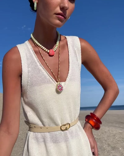 Video of model with Equinox Charm Necklace, Arc and Ridge Cuffs in Persimmon, Cascais Hoops in Lime, Sebastian Necklace.