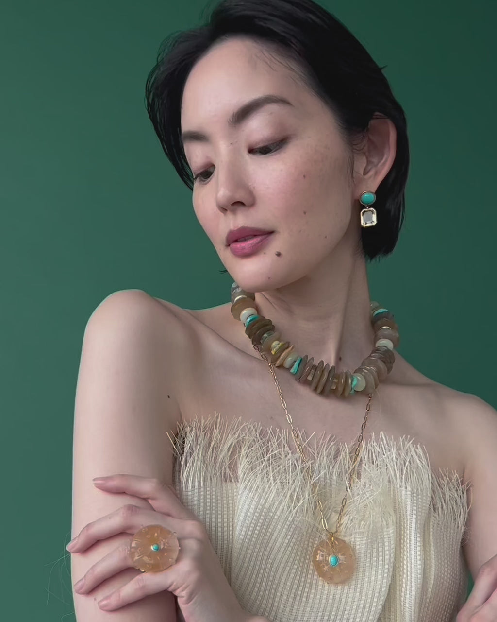 Video is a close-up of model wearing Milano Collar along with Mini Lush Earrings in Lemon