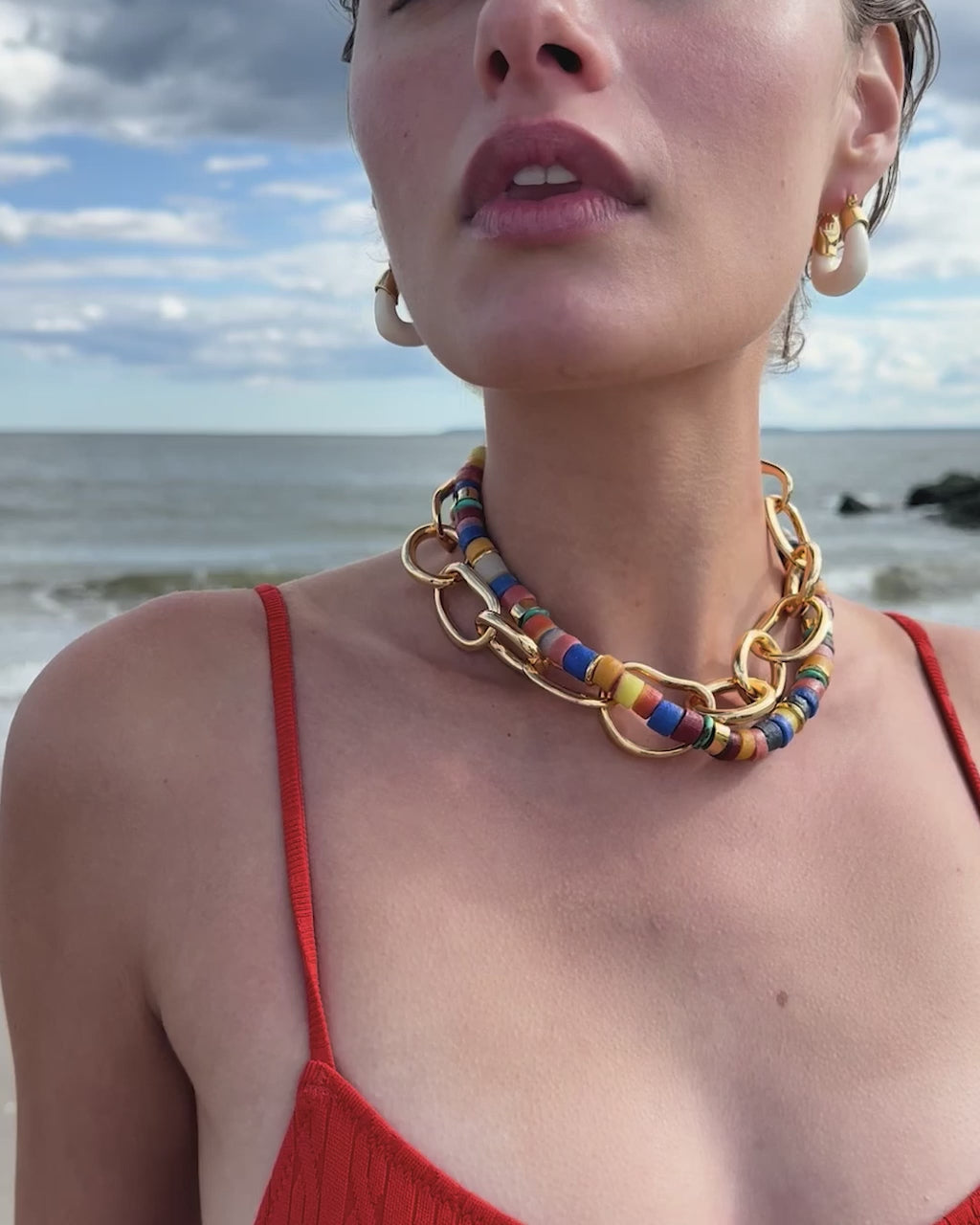 Video of model on beach wearing Lido Necklace, Porto Chain and Mini Organic Hoops in Alabaster