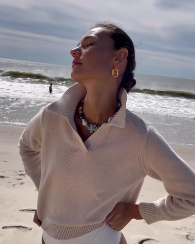 Video of model on the beach wearing Mistflower Necklace with Tile Earrings in Pale Pink.