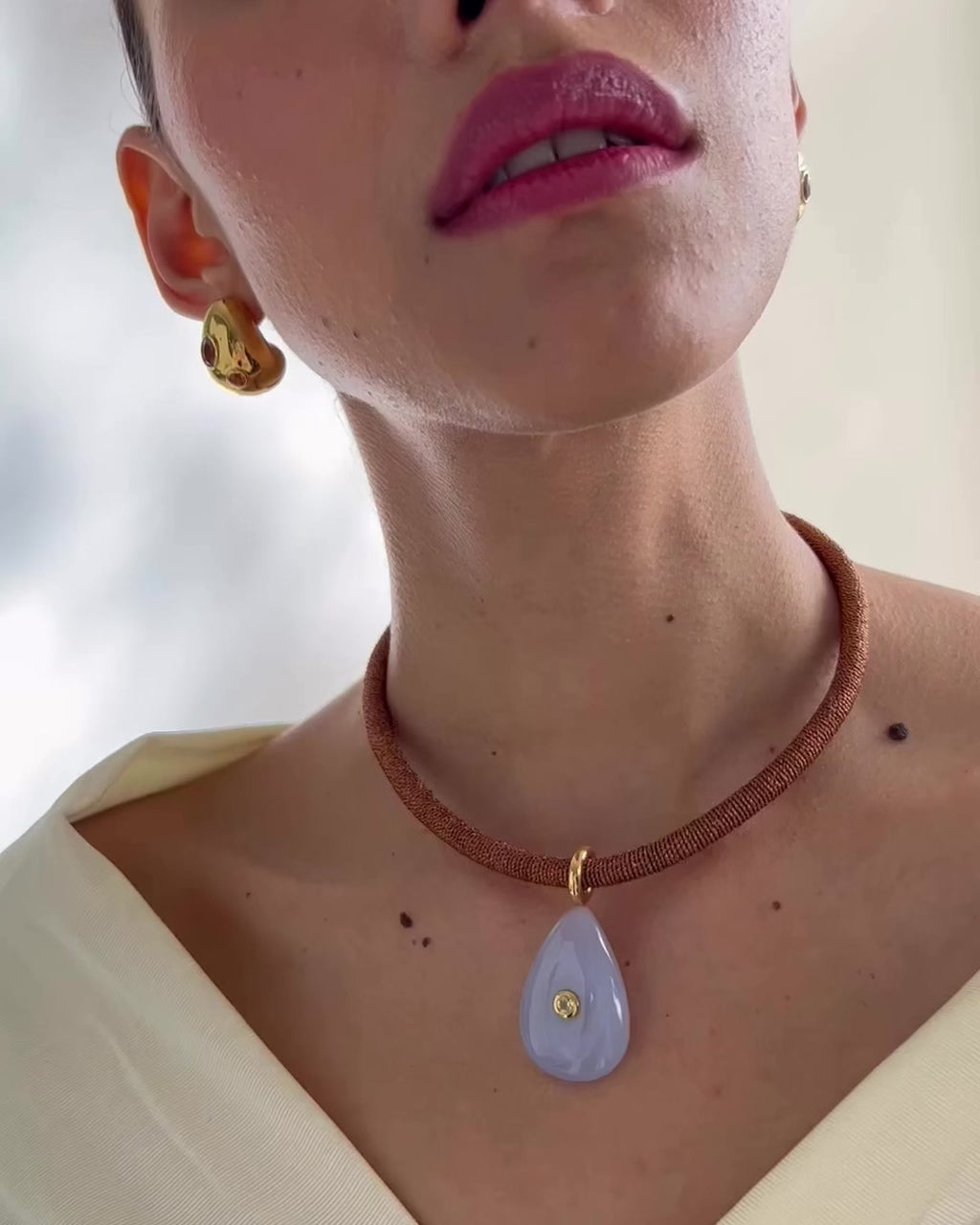 Video shows a close-up of model wearing Dream Weaver Collar.