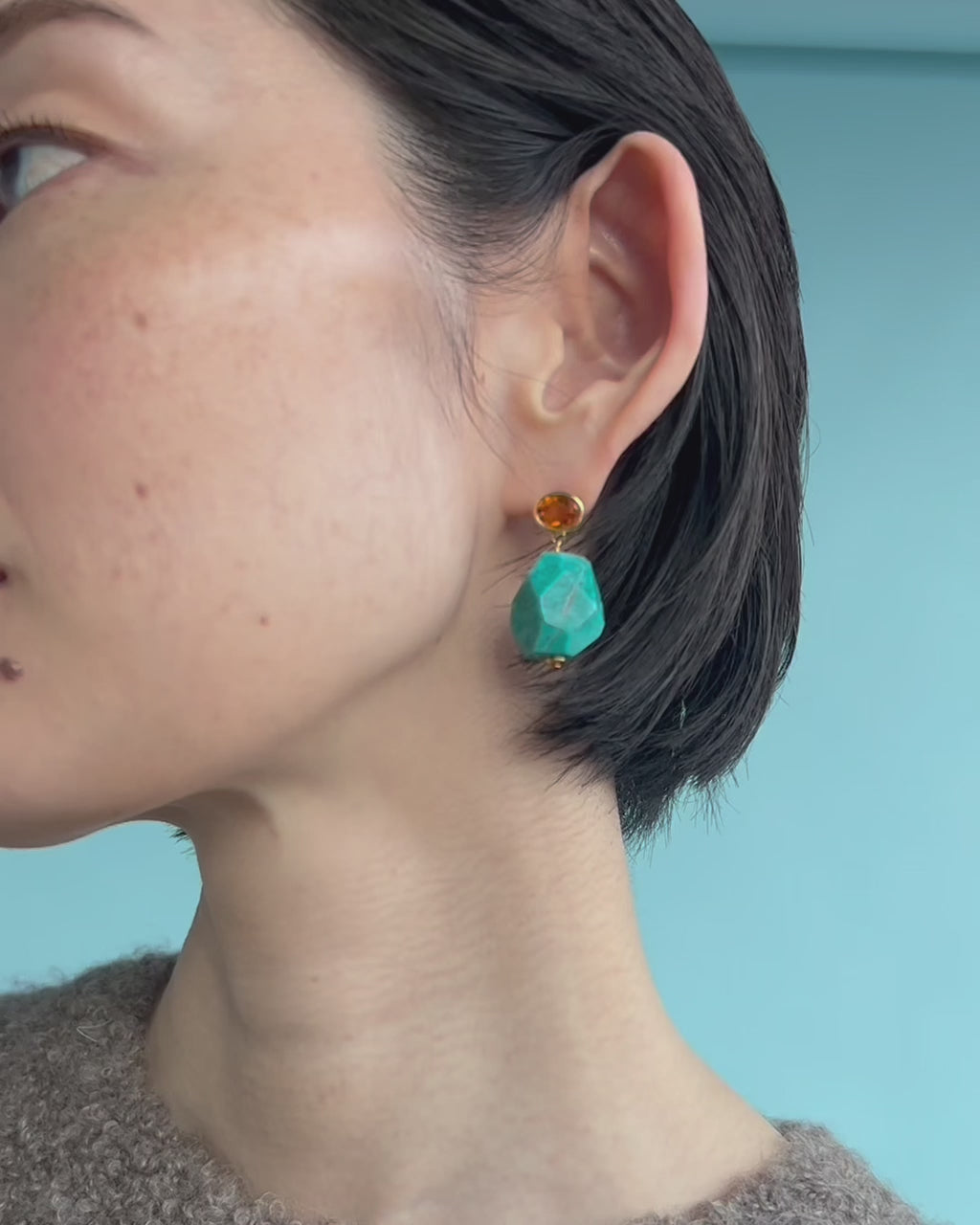 Video shows a close-up of model wearing Galapagos Earrings.