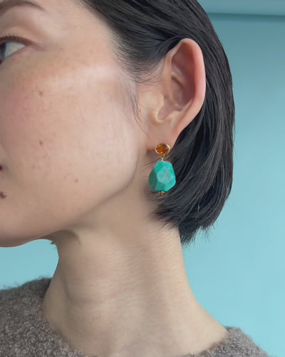 Video shows a close-up of model wearing Galapagos Earrings.