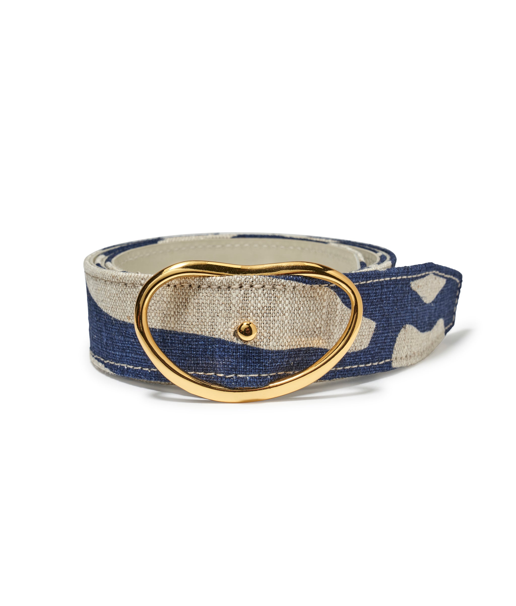 Wide Georgia Belt in Indigo Zebra. Rolled up thick belt in blue and beige animal print linen with gold-plated kidney buckle  