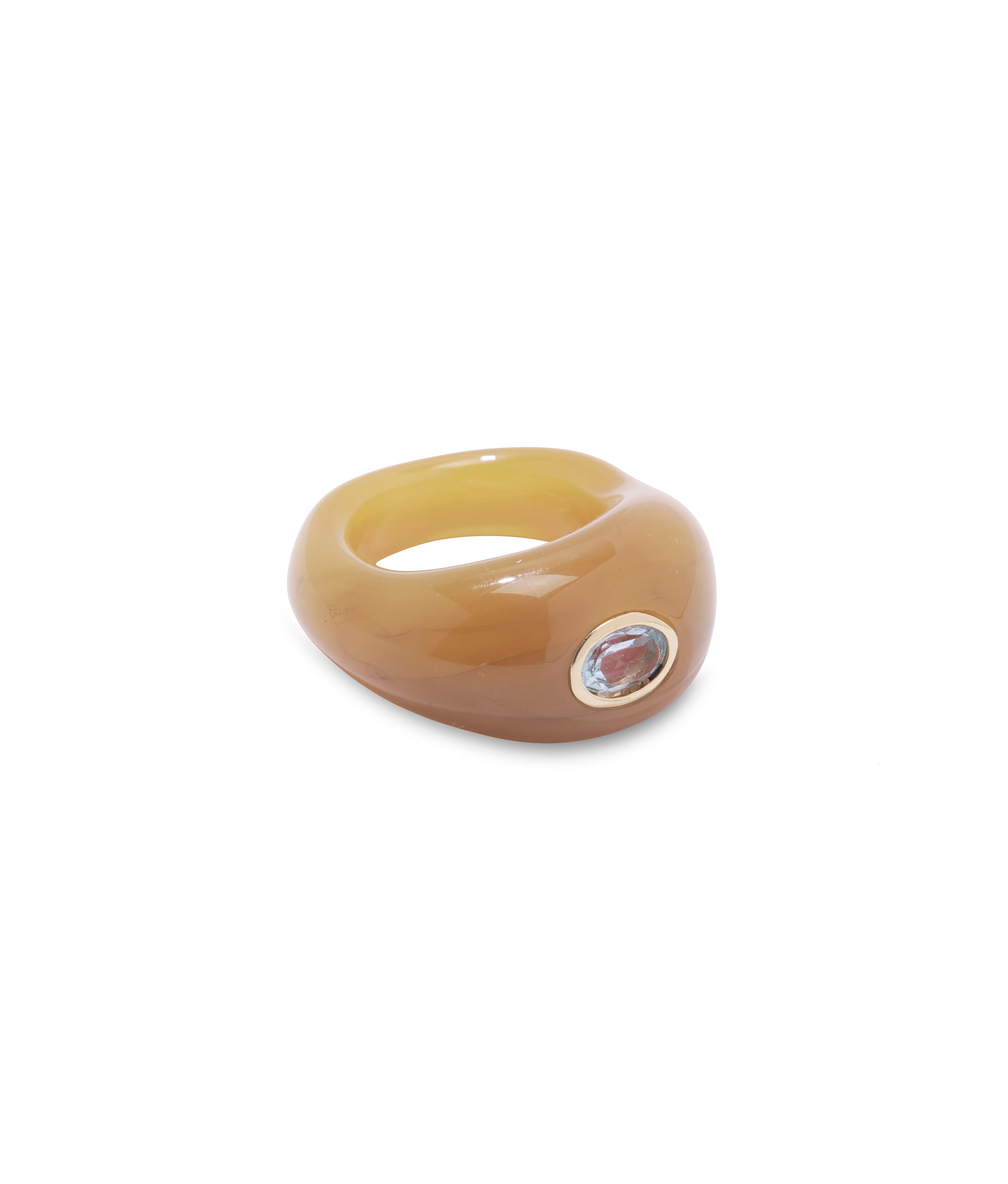 Monument Ring in Ochre. Domed yellowish glass cocktail ring set with faceted blue topaz.