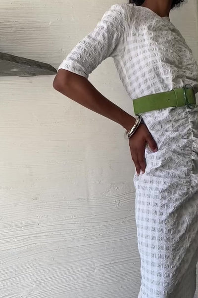 Video of model in white ruched dress, green belt and Circuit Bangle.